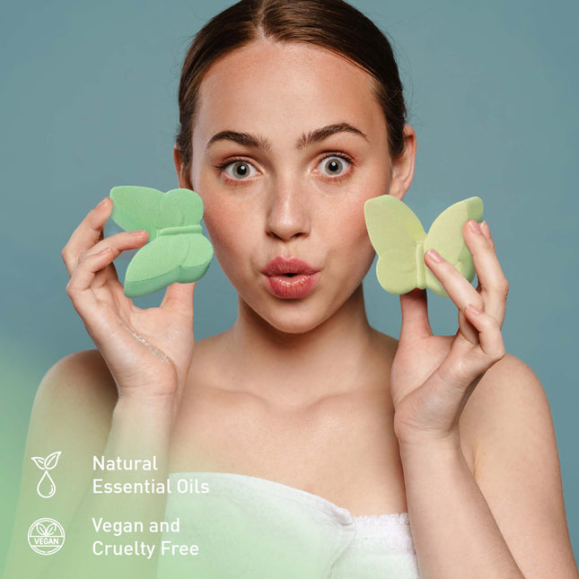 Woman holding two green butterfly-shaped bath sponges with text highlighting natural essential oils, vegan and cruelty-free